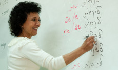 Hamorah Sigal Reuveni clarifying a point of Hebrew grammar to class Aleph-3 at the Ulpan Etzion Absorption Center at Beit Canada in Jerusalem